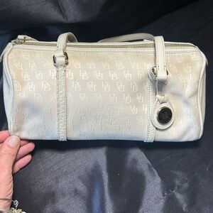 Dooney & Bourke Cream Clutch with Monogram Pattern